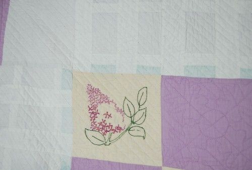 The quilting is SUPERB, with quilting around the floral designs and in 