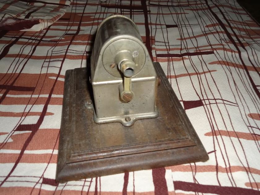 Vintage Stewart Pencil Sharpener 1920s on wood display stand  